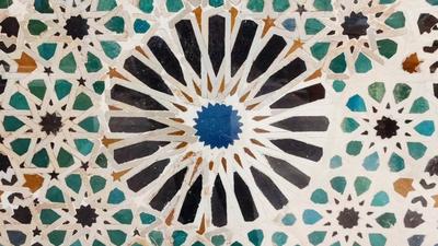 Islamic ornaments on the walls, floors and windows of the Alhambra, a historic palace and fortress in Granada, Spain, and a UNESCO World Heritage Site.